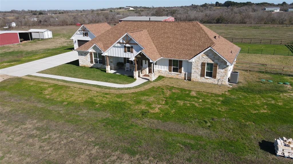 30 acres with 2,539 SF home and 12,000 SF Barn, located in the rolling hills of Whitehall.  The home built in 2024 features a 3 bed 2.5 bath split floor plan with large family/greatroom. Enjoy fabulous views from the back patio which overlooks the rolling hills and green pastures. The front porch offers beautiful sunsets and overlooks more green pastures and FM 362. This area is highly sought after being only 2 miles off SH 249 making the commute to The Woodlands, Houston or College Station a breeze.  Private water well, septic system.  Fenced and cross fenced.  Bring the livestock, Horses, Cattle, Goats, Dogs etc.  Light covenants to protect value.  This tract has over 800 ft of FM 362 frontage. Located right across from Vista Hills with wonderful long distance views.