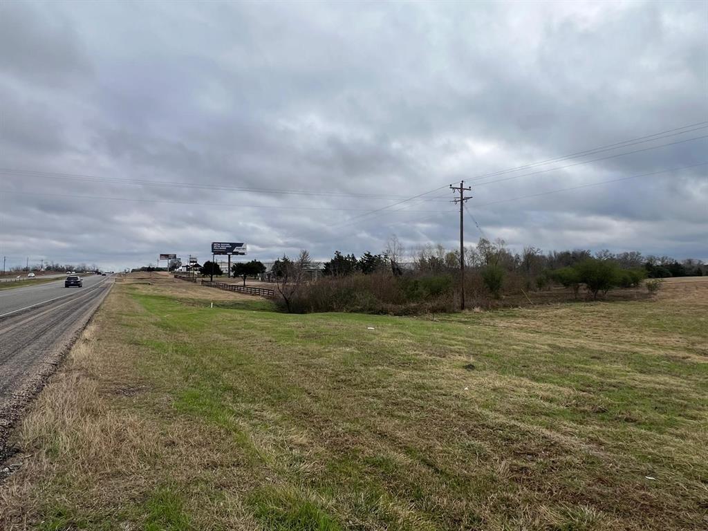 Prime road frontage on Hwy 290! This 12.25-acre property offers an excellent location for a variety of uses, whether for a business venture or a horse ranch. Owners are highly motivated—bring your offers today!