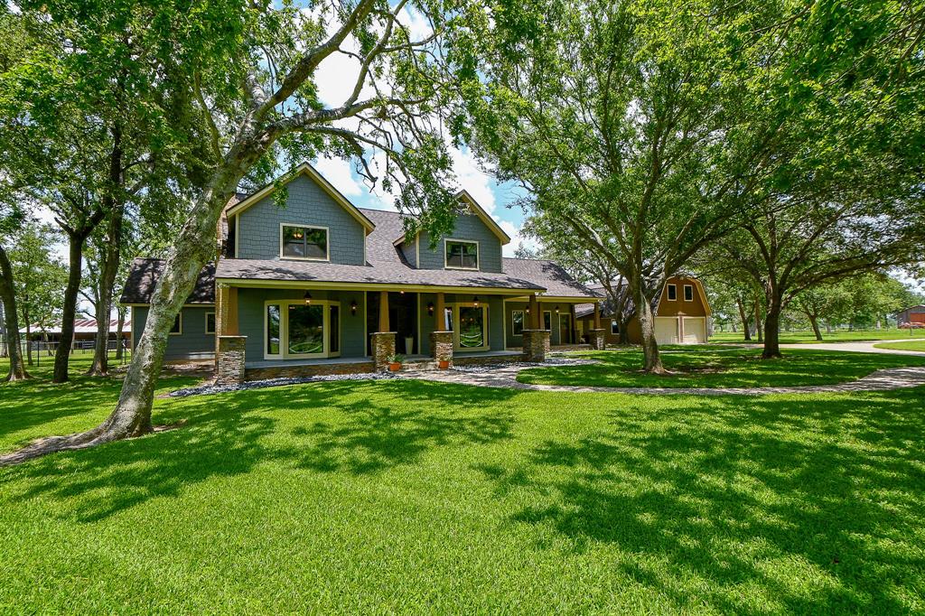 Country Living at its finest! Over 15 acres, beautiful, renovated home with large porch, impressive front lot with, expansive sprinkler system, shade trees and circle driveway. 5 buildings include, two - two car garages for large vehicles, one of the garages has a game room and bedroom on second level also additional workshop with garage door for a possible 5 car space. The other buildings used as a chicken house or greenhouse, barn with stalls, storage and large garage space for tractor storage plus tool shed/well house. Plenty of room for cows to roam in back pasture plus shade trees and pond. One of your favorite places will be the back patio and enjoy peaceful views. New Roof 2024! Fantastic home with elegant hardwood floors, updated island kitchen, scenic views from breakfast room. spacious family room for gatherings, primary bedroom downstairs with double doors to backyard patio, upstairs with three more bedrooms & two full bathrooms. Attic storage in 2nd level of home & garage.