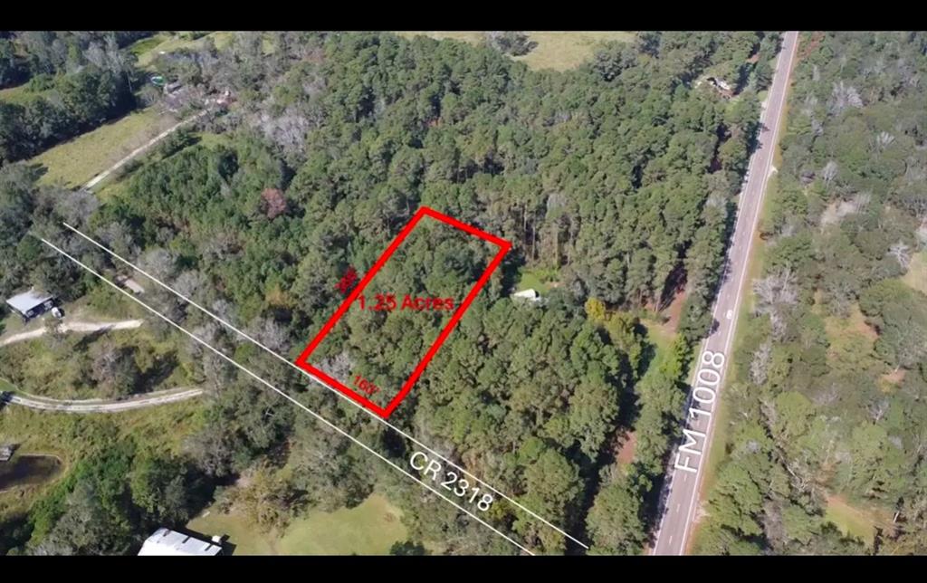 This property is situated in the W Donaho subdivision and provides a peaceful, rural setting. Nearby schools include Stephen F. Austin Elementary, Woodrow Wilson Junior High, and Dayton High School. 1.24 acres to build as desired-   Barndominium, single family home or mobile home site etc.