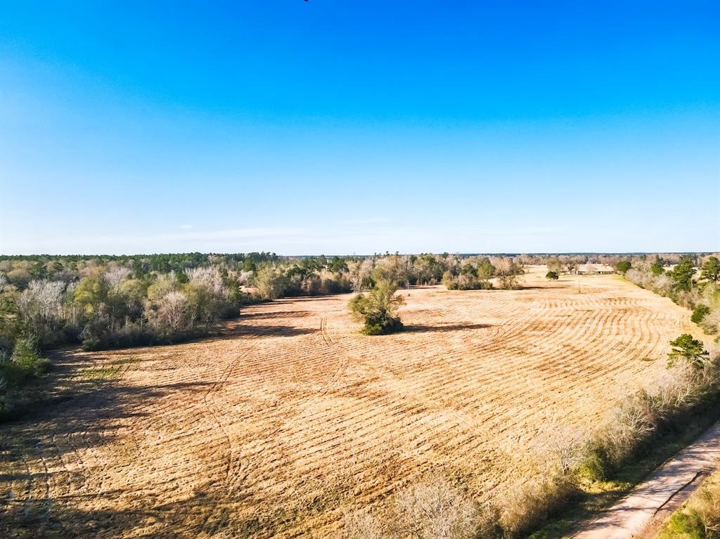 Welcome to Apple Springs, Tx. Fifty acres of ag exemption with a good mix of native cover and open pasture, with fences on three sides. Two good ponds provide water for livestock and wildlife. Incredible hunting opportunities throughout with trails meandering through the property. There is a 2 bedroom, 1 bathroom home, offering a starting point for your vision. With over a half mile of county road frontage, your future dream home awaits. Electricity & community water are in place on the property. Endless possibilities!