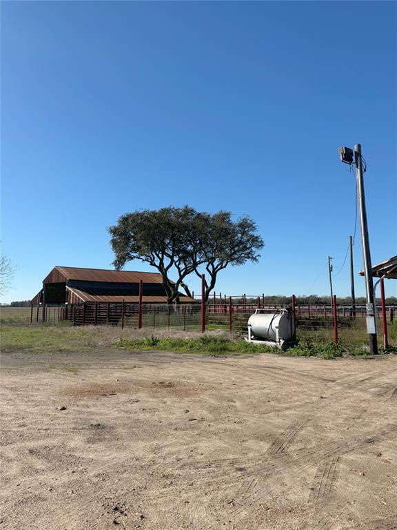 This turn key cattle ranch was once a turf grass farm! What does that mean.....all 164.55 +/- acres can be irrigated. This property is perimeter fenced and cross fenced with new fencing, gates & concrete water troughs to all traps. Cattle shades, working pens, cattle chute and barn. Underground irrigation, irrigation well (12" casing with 10" well), pump and relift. Stocked pond, 40 acre hay meadow and land is leveled to slope to canal. This rectangular shaped property with all its amenities is ready for your cattle herd! Or if turf grass is your venture the infrastructure is here. Minutes from Highway 59. More photos and aerials coming soon!