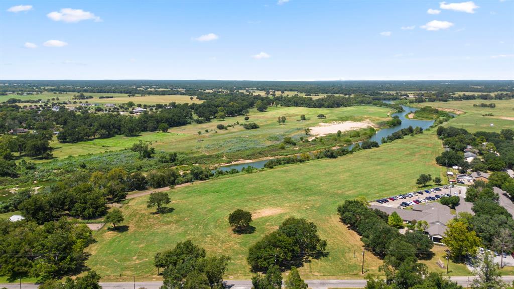 14 Acres of RIVER FRONT land in Columbus TX; Prime location just off Travis and North St in Columbus currently unincorporated but next door to city services. Has flexibility to subdivide or keep as a private estate and keep those amazing views all to yourself!  Potential for event venue, development, or so many options.  Request a tour today.