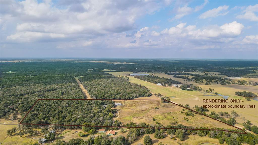 Approximately 2900 FOOT OF ROAD FRONTAGE on 2 main PAVED county roads.This prop is the very best of both worlds, offering thick woods with beautiful established OAKS and pines and open, lush pastures with a small POND and barn. The HOME located on the property is a 2002 manufactured home with 2016 square foot of living space. The home is in good condition and can be lived in right away or the perfect place to live while you build your dream home on the land. The home offers 4 bed and 2.5 bath, a large updated kitchen, multiple covered porches, and some recent upgrades such a newer water heater and AC/heat pump. A second home occupies the property as well and with some TLC could potentially be another residence or guest home for the property. TWO Co-op water meters (Deanville Water) in place, as well as TWO electric meters. The large pole barn has electric and water, horse stalls and many storage areas, including a tack room and a built in chicken co-op. Call to schedule a showing today