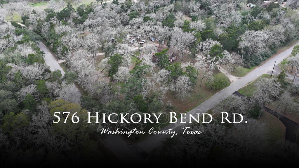 Approx. 2.602 acres located only minutes from downtown Brenham, Texas with road frontage on Windy Acres Road and Hickory Bend Road. This corner, wooded lot features a brick home being sold as-is and ready for a complete remodel or demo to build a new, custom home. There are several small outbuildings and electric and community water are in place.