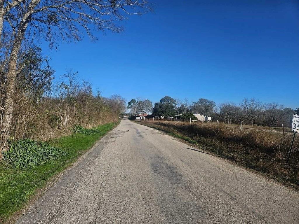 9/10th mile from light in Chappell Hill. Less than 1/4 from Highway 290. Has road frontage on Nicholson Lake Rd & Chadwick Hogan Rd. No restrictions. House on property has no value.