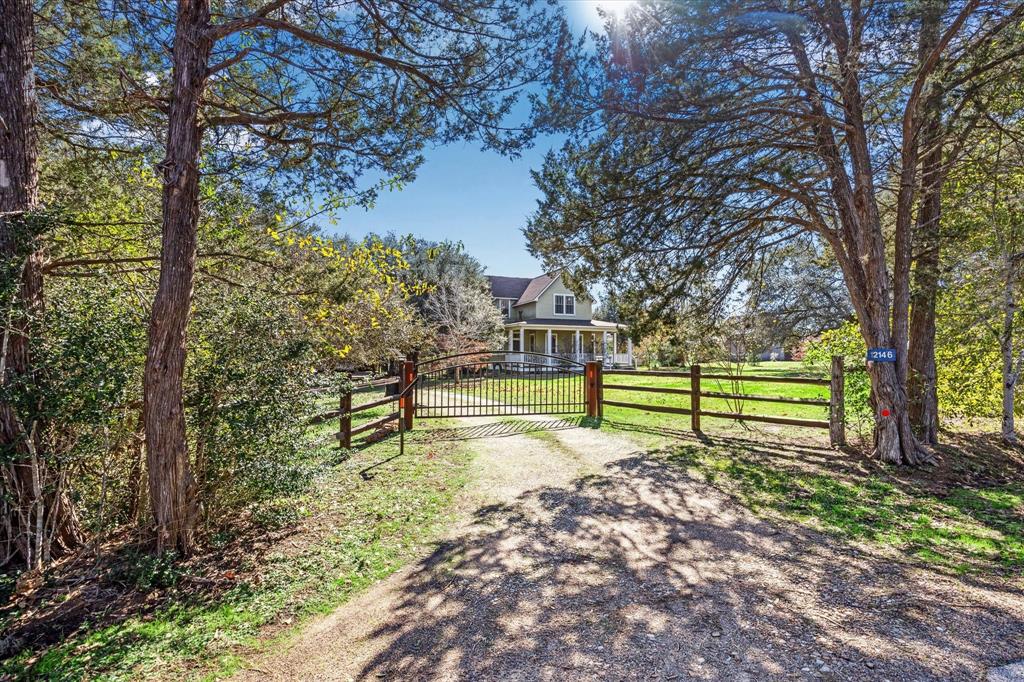 Welcome to your dream home! Picture yourself on the tree-lined drive leading to this stunning property. Featuring majestic oak trees, a private gated entrance allowing for either remote or keypad accessibility, and two cozy fireplaces for those chilly nights. Situated on 2.11 acres, this oasis boasts 3 firepits, multiple fruit trees, lush greenery, and a greenhouse. Perfect for relaxing and enjoying the serene surroundings. Located in the sought-after Cat Spring, Texas, this property offers a fenced backyard for your furry friends and underground electric lines to preserve the breathtaking views. The home features 10' ceilings on most of the first floor, and 9' ceilings on most of the second floor. Don't miss out on this incredible opportunity to own a piece of paradise!