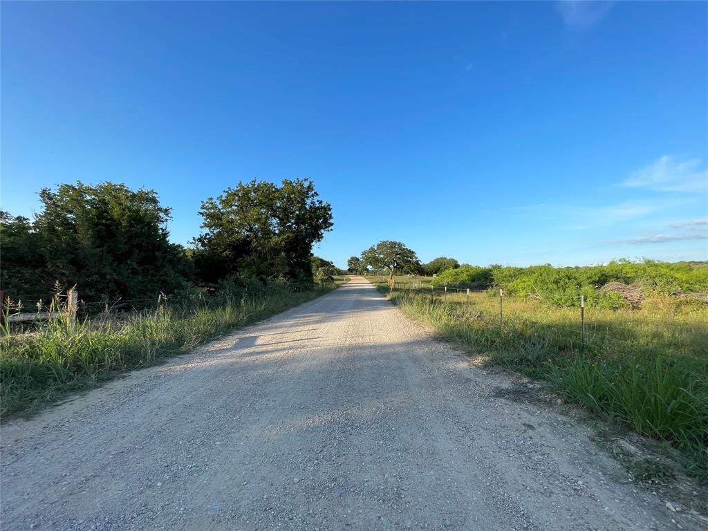 This stunning 23 +/- acre plot in Harwood, Texas, offers the perfect canvas for your dream retreat. Conveniently located just minutes from Luling and I-10, and within an hour’s drive of Austin and San Antonio, this property combines the tranquility of country living with the convenience of easy access to major cities. Houston is just a two-hour drive away, making this an ideal location for a getaway or permanent residence.The gently rolling terrain is covered with beautiful hardwoods, providing a sense of connection to nature and endless opportunities to customize the space to suit your lifestyle. Build your dream home, create a peaceful retreat, or establish a haven for outdoor recreation. A 30x45 covered pavilion and a small pond add to the property's charm, offering immediate functionality and serene views. 
Come explore the possibilities and turn this beautiful plot into your personal slice of heaven amidst the quiet beauty of the Texas countryside.