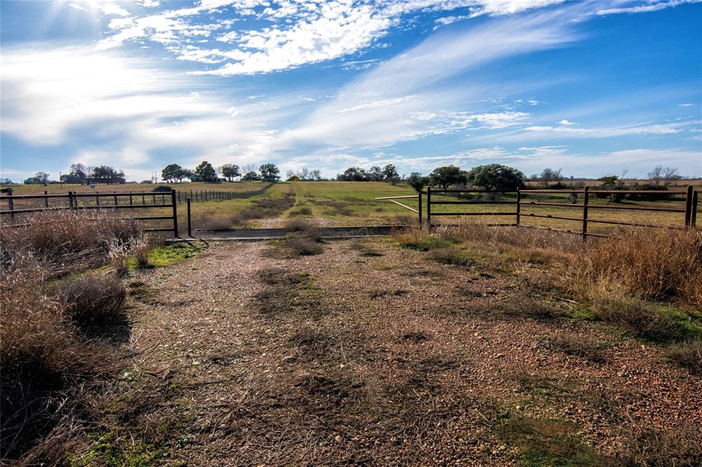 Discover your slice of Texas tranquility on this improved, unrestricted property ready for your vision. The scenic parcel features existing cattle pens and offers the perfect blend of functionality and natural beauty. Whether you're seeking a weekend retreat, a recreational spot, a livestock property or a permanent homestead, this land presents endless possibilities. Create your dream build site while enjoying the peaceful countryside atmosphere. The property is ideally suited for both agricultural pursuits and leisure activities. Experience the charm of rural living while maintaining modern conveniences in this versatile Hallettsville location - centrally located from major cities like Houston, San Antonio, and Austin.