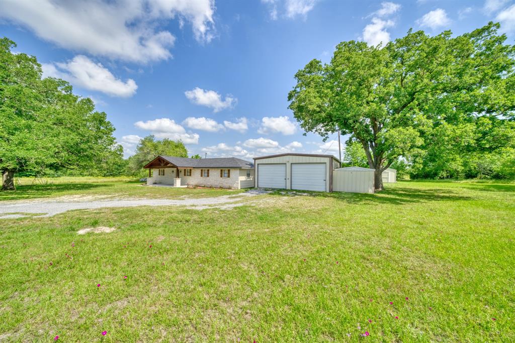 Nestled on almost 2 acres amongst mature oak trees, this newly remodeled home has much to offer. The exterior features include a large front porch and a stone fa&#231;ade while inside you will find 3 bedrooms 2 baths with an open concept kitchen and living area. Outside you can spend your time in the 25x30 shop suitable for anyone’s extra projects. Located on Hwy 75 South just minutes from town, you still have the quietness of the country. Don’t miss this great property.