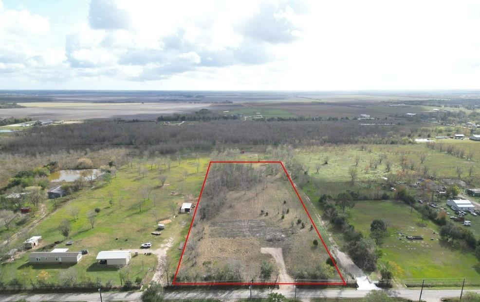 This 4.7+/-acre unrestricted lot located in the charming city of Alvin, Texas. The lot is partially cleared, offering a balance of open space and mature trees. Just completed a new drive off CR 159 and recently fenced with residential or commercial use. Situated on County Road 159, the property provides a tranquil and rural atmosphere while still maintaining convenient access to nearby amenities and major roadways.The property offers a great opportunity to build your dream home in a peaceful setting. The combination of ample space and natural surroundings allows for various landscaping and outdoor recreation possibilities. Whether you're looking to create a private oasis or establish a homestead, these 4.7-acre lots presents a promising canvas for your vision with no restrictions or flood zone!