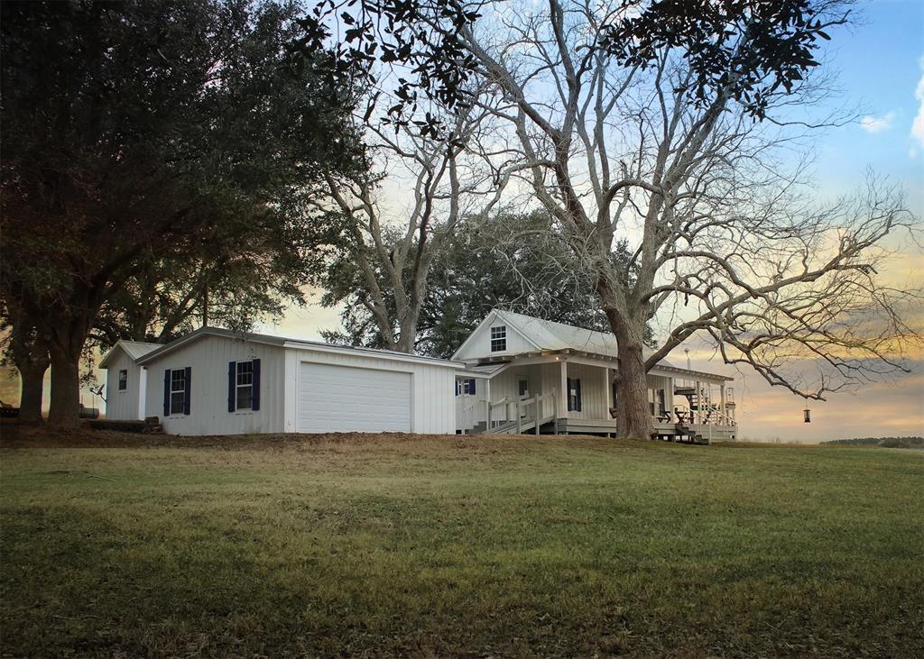 This very secluded 1950s farmhouse features 1 bedroom, 1 bath, and a spacious upstairs loft bedroom/den which opens to an observation deck with stunning views. The 40-acre property is a nature lover’s paradise, boasting a serene creek, rolling hills, and a pond. Whether you're seeking a peaceful retreat or a picturesque homestead, this property offers endless possibilities. There is a newer garage and water is provided by your private well. Wildlife exemption in place. The tax record reflects 680 SF, but that is not believed to include the upstairs loft area. The private drive back to the cabin is deeded (not at easement) so you don't have to worry about letting neighbors cows out.