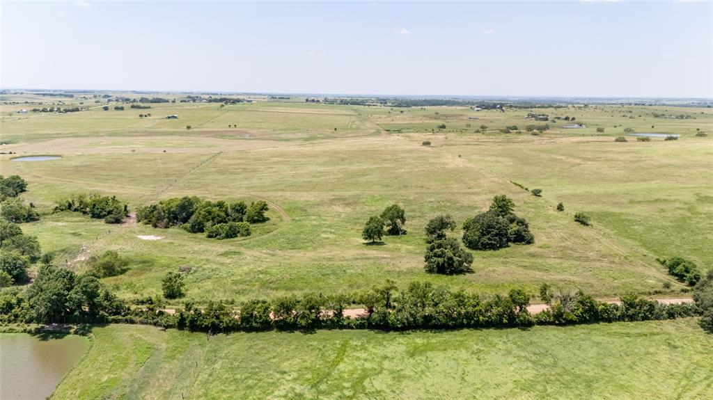 Land: they don’t make more of it, so buy it now as opportunity calls with nearly 19 acres available in Yoakum! Nearly a perfect rectangle and vastly cleared, the property’s gently rolling hills are recently fenced to distinguish clear boundary lines on all sides, corresponding with the recently completed survey. Currently ag exempt. Well and septic tank will need to be added. Only 8 miles from Shiner, 9 from downtown Yoakum, 22 from Hallettsville, and less than 25 miles from I-10, this little piece of country paradise offers a sizeable, but manageable, slice of peace and tranquility underneath the Texas sky for the city-slicker, country-dweller, or one who falls somewhere right in between.