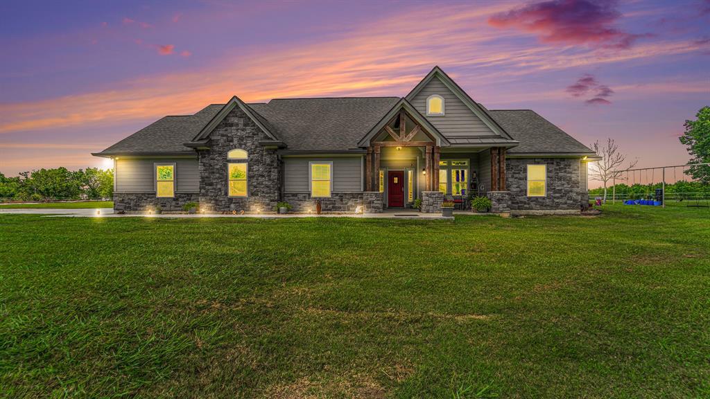 Step into a world where country charm & city conveniences meet on this exquisite gated custom-built home all nestled on 13+ acres. You'll be captivated by the beauty & tranquility that surrounds you. Bring your horses to the spacious riding arena & building equipped for stables. Need space for your workshop or RV? There's a workshop & designated RV hookup waiting for you. Exploring, you'll stumble upon a serene one-acre pond, perfect for summer days filled with swimming, fishing, & water sports. Imagine your Pontoon launched from the boat ramp for endless hours of fun. The 2500 sf home full of comfort & style, offers 3 beds, 2 baths, office, breakfast area, & flex room. The family room's adorned with a striking floor-to-ceiling stone fireplace & windows overlooking the pond. Start your day on the front porch & wind down with breathtaking sunsets from the covered back patio. This property is a lifestyle of serenity & natural beauty & more than a home; it's an escape from the ordinary.