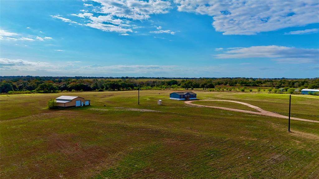 Country living on small acreage just outside of Yoakum. Come set your bags down and move right in! This 1,386 SF manufactured home sits on 5 acres with a barn, and is perfect for the horse enthusiast or those looking for a home for their FFA and 4H projects. The 3 bed, 2 bath house has spacious bedrooms, a large living room, and an open concept floor plan. The farm house kitchen comes equipped with stainless steel appliances and a washer and dryer. The master suite features a large bathtub and a separate walk-in shower. Sit on your back porch and enjoy the countryside.  Bring your horses and livestock, the property has brand new perimeter fencing and a 50x36 barn. The barn has water and 2 roll up doors for easy entry and exit. Located on FM 318, this property is just minutes from Yoakum, and a 5 minute drive to the quaint community of Sweet Home.  Small tracts of land with in place improvements like this are hard to find.  Come take a look and start living the country life!