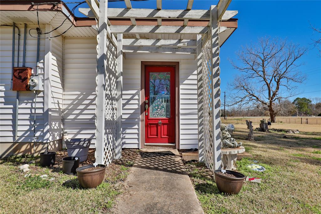 Land sprawling with abundant pecan trees and wildlife, fully fenced for livestock. Property features two water wells, one for animals and one for people, with a 485' deep well for the house. Owners have no knowledge of the condition of the 2nd well.  The 2900 sf house, known as The Cowboy House, boasts durable shiplap construction and has been expanded over the years. Conveniently located near Phillips 66, Sweeny, Tenarus, and Bay City, offering commercial potential. A unique opportunity to own a piece of history with endless possibilities. Don't miss out on exploring this charming property today.