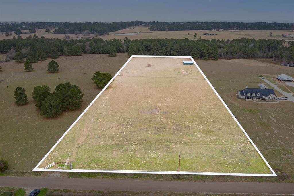 Seven acres rolling pasture on paved road 344 only 1.2 miles from New Aggie Expressway. Fully fenced and partially cleared with gravel drive, Cross fenced with two storage containers and car port in back of property. Livestock welcome. Public water, meter already set, and power runs across front of land.