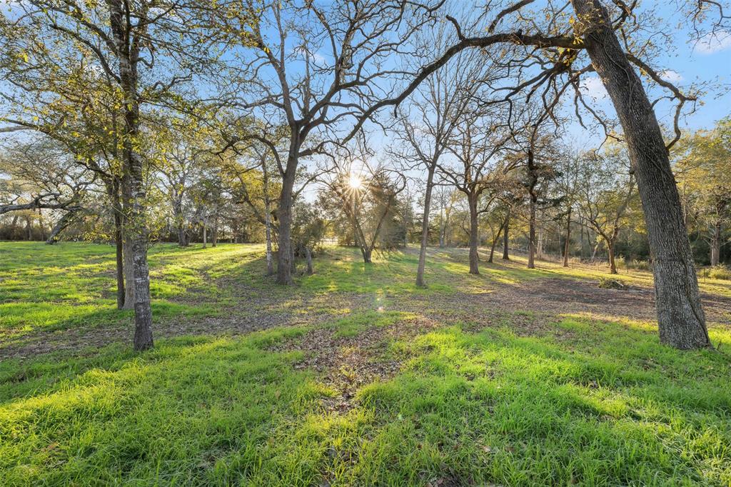 Small Acreage, Hard to find! Conveniently located between Houston and San Antonio in Colorado County, this ~15-acre property is located just 10 minutes east of the town of Weimar, and 20 minutes west of Columbus, on county road CR 207. The property is a rare find in a desirable area out of town, while close to nearby boutiques, grocery stores, and other town conveniences. The land features a mostly wooded landscape and a few clearings with great home sites, ideal for building your dream home or recreational fun. Abundant habitat for native wildlife. This tract has approximately 630 ft paved frontage and a depth of ~1,000 ft. 
The property has electricity on site waiting to be connected to your desired location, and has partial fencing. 
The land consists of loamy fine sand soil, with elevations ranging from 330’ to 350’, and is out of the floodplain.
This property is Ag-exempt, no pipelines but does have a transmission line/easement across the southwest corner.