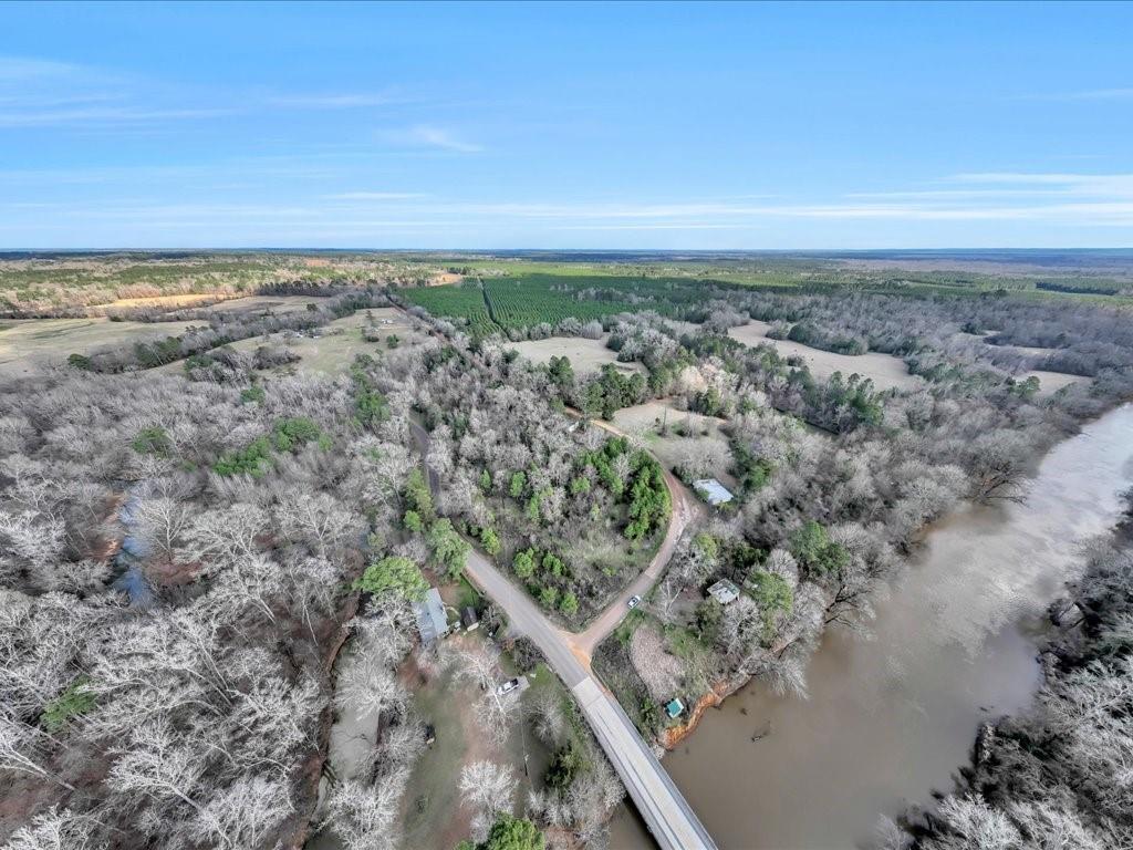 A rare opportunity to own 103.09 breathtaking acres in the heart of Douglass, TX, offering an impressive 3,876 feet of Angelina River frontage. This remarkable property features a perfect blend of open pasture and wooded areas, making it ideal for hunting, fishing, recreation, or a private retreat. Located within the Douglass ISD, this land is a fantastic investment for those looking to build, farm, or enjoy East Texas' natural beauty. Don't miss this chance to own a slice of paradise with endless possibilities!