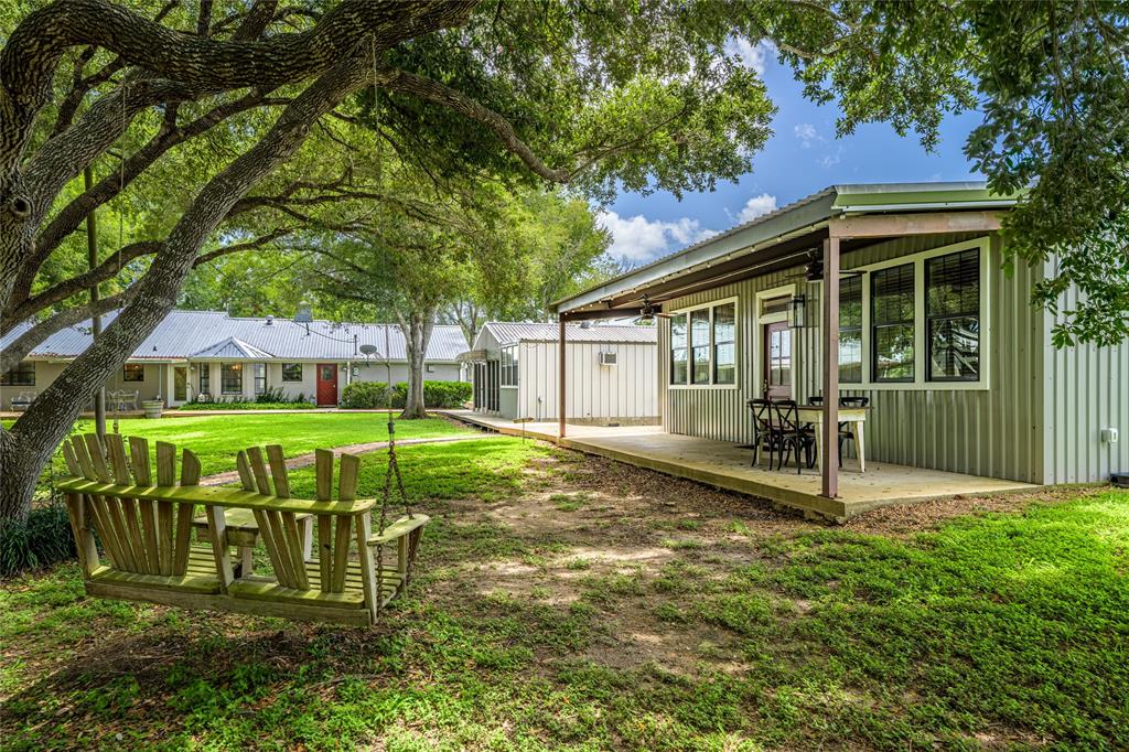 In the Heart of Shelby, Texas – Only 10 Minutes from Round Top – This beautiful property boasts 3 separate houses. It would be ideal as a vacation rental or your country home with plenty of separate space for guests. The main house has 3 bedrooms, 2 bathrooms, and an open concept living dining kitchen area. The bunkhouse has 2 bedrooms, 1 bathroom, and a freshly updated kitchen. The casita has 1 large bedroom,1 bathroom, and its own kitchen. In addition to the 3 separate houses, there are outdoor entertaining areas amongst the live oak trees. Take a sip of your favorite beverage on the porch or deck areas. Gather around the fire pit area and enjoy the beautiful country life of Shelby, Texas. All of this and Round Top is only 10 minutes away!