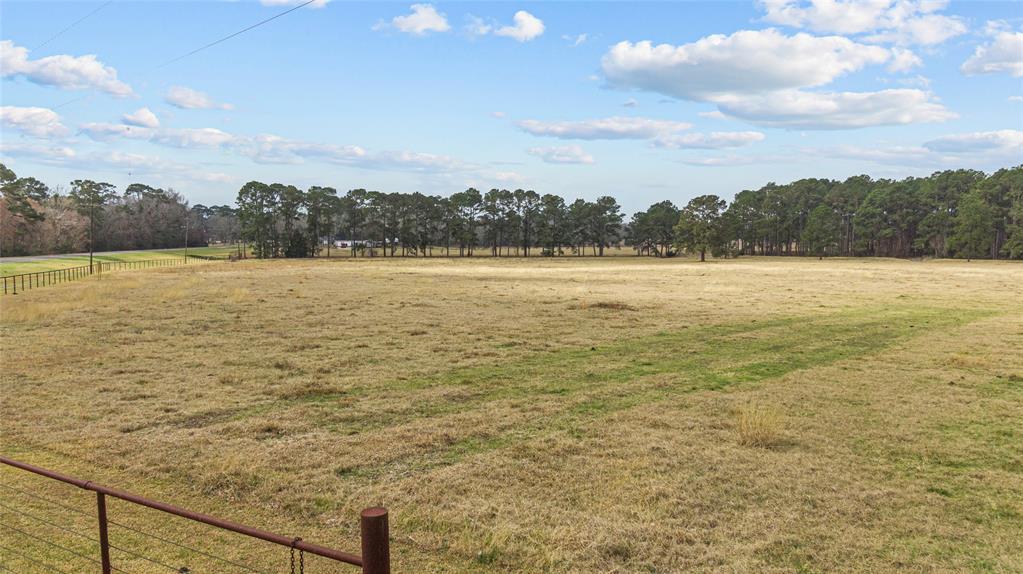 You'll LOVE this 13.477 acre tract which is clear and ready for your dream home.  Located just a couple miles north of I-10, 10 minutes from Mont Belvieu and Highway 99, and 45 minutes to both downtown Houston and Beaumont. This property is unrestricted and would make a fabulous mini-ranch.  Water available through Trinity Bay Conservation District.  An additional, adjacent, 30+/- acres is available via separate purchase if you’re looking for a larger tract. Please do not enter property without permission.