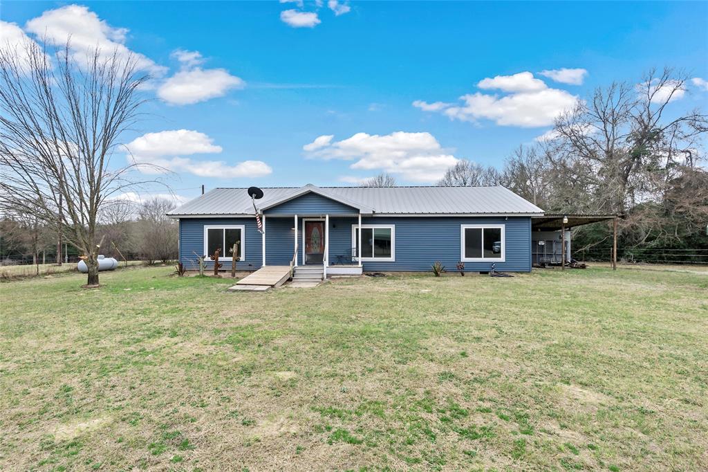 Charming 3-Bedroom 2-Bath home nestled on 5 acres of serene land and recently updated with new paint. Enjoy the outdoors with a cleared yard featuring beautiful large trees and a wooded area in the back. The property includes two detached carports and multiple sheds, providing ample storage and parking space as well as a generator to have available as a back up during storms. Located 15 miles from Lake Limestone, this home offers a location for those seeking space, nature and access to outdoor recreation. Don’t miss this opportunity—schedule a showing today!