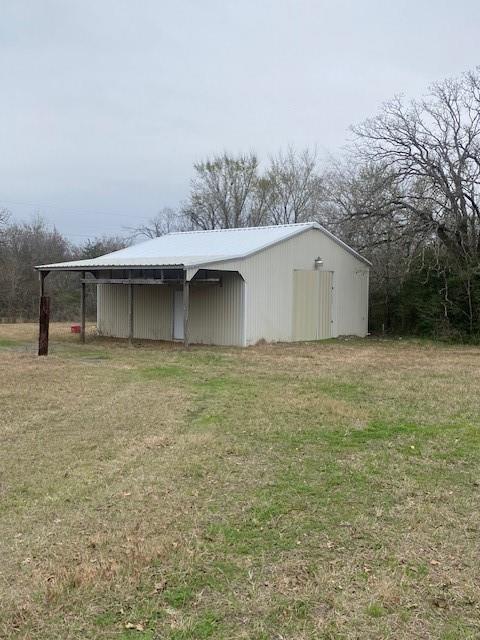 COME TO THE COUNTRY AND BUILD YOUR HOME OR BRING IT WITH YOU.  6 UNRESTRICTED ACRES WITH 900' METAL BUILDING WITH DOUBLE BAY DOORS.  ELECTRICITY TO BUILDING BUT WILL NEED REWIRING.  DRIVE THROUGH FROM ONE TRACT TO THE OTHER. TWO PONDS ON THE 6 ACRES.  WELL AND SEPTIC ON THE OTHER SIDE. PROPERTY MAY NEED SOME TLC BUT PRICED ACCORDINGLY.