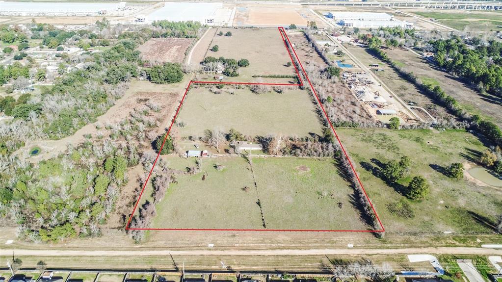 Great opportunity to own 12+ unrestricted acres in Tomball with access to Boudreaux Rd.  Great location near Hwy 249 and 99/Grand Pkwy. Property does have house, barn, and other small structures, but is being sold at land value only.  Property has well and septic. Not in flood zone. This property has a 30' wide access (gate to be installed) from the frontage on Boudreaux along the east side of the property to the main acreage in back.