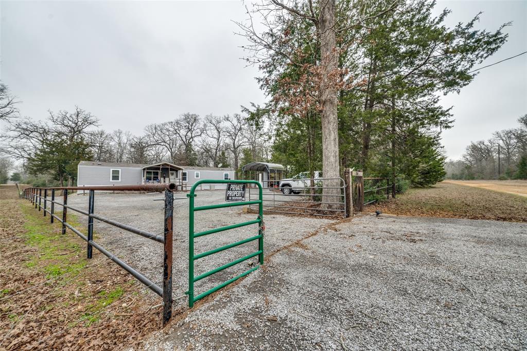 This is a hunter's DREAM, with 38 acres of wooded land and a FULLY FURNISHED home built in the SE corner (to give plenty of room for wildlife), there are so many features of this property, including 3 deer blinds each with a protein feeder and corn feeder, cleared paths throughout (perfect for a 4-wheeler), large shed with attached carport and wired lighting, huge slag driveway added in 2024, gated entry, insulated water well house, pond, and multiple game cameras throughout!  The 2018 Clayton Manufactured home also has a large front and back covered deck, a firepit, automatic outdoor party lights around the home, and a Blackstone griddle.  Inside you will find a fully furnished, 3 bedroom 2.5 bathroom home with large bathrooms, a fully equipped kitchen (with an island!), and a washer and dryer included.  This is the perfect getaway location from the city!  Reach out today for a tour of the property!