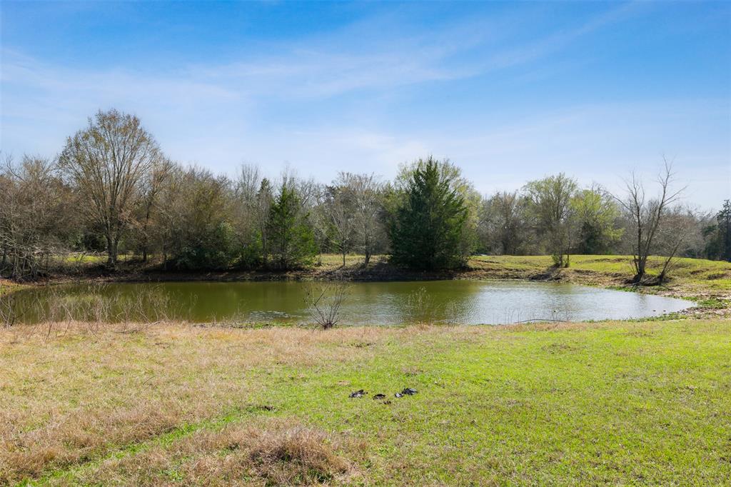 What a great location, this 44.22 acre tract is located in a quite area of Burleson County just a few minutes to Caldwell.  It is located just 0.2 miles off FM 975 onto CR 126 which is a great paved road.  The stunning hill top area has several great build sites for a cabin or forever home.  The sandy loam soil with improved and native grasses is in ag valuation for low annual taxes at this time and the new owner can apply as well.  The property is almost half wooded and half open with scattered trees.  There are great trails through the wooded area for walks or ATVs.  It has two ponds and a 400 foot water well on site that needs attention.  Bluebonnet Electric electricity is on site.  A small metal barn to store equipment is located near the wood line.  Seller to retain all mineral rights.  A cattle grazing lease continues until September 6, 2025.  Location to Brenham - 30 miles, College Station - 35 miles, Austin - 85 miles and Houston - 105 miles.  Must see!