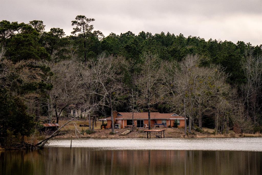 !!30+ ACRE PRIVATE LAKE!!  This 99.23 acres is truly a one of a kind property for a private get away or dream home. The 30+ acre lake, once part of the private water fishing club, is stocked with trophy crappie, 10+ pound bass and catfish. The home sits above the middle of the lake with a large patio out back to sit and take in the panoramic view of the lake and abundant wildlife. The 357sqft guest home is a two bed one bath with a small kitchen and living room. This is truly a once in a lifetime property you must see for yourself.    

                

Price Reflects completed full remodel of the main home and guest home which is currently underway. Please contact the listing agent for details.