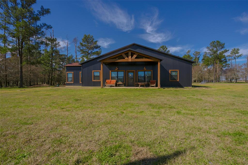 Custom 3-bed, 2-bath barndominium on 17.5 fenced acres, built by Aces Barns & Buildings, offers the perfect blend of modern living and country charm. The open-concept living and kitchen feature granite countertops, custom cabinetry, and a large island with seating. A flexible bonus room with sliding barn doors can serve as a dining room, office, media room, or even a 4th bedroom. Main bedroom has spacious en-suite that includes dual walk-in closets, dual vanities, a soaking tub, and a tiled shower with a rain head. A 24x19 work-from-home shop at the back of home has high amp outlets, plumbing for a work sink, and a 9x9 office with a separate entrance. The 2-car garage has spray-foam insulation with a 220-volt outlet and automatic garage door opener. Enjoy fresh, clean water from the 320’ well, plus a 2023-installed water softener. With light deed restrictions, bring your horses, cows, or chickens. A transferable home warranty offers peace of mind. Check out the 360 VR tour today!