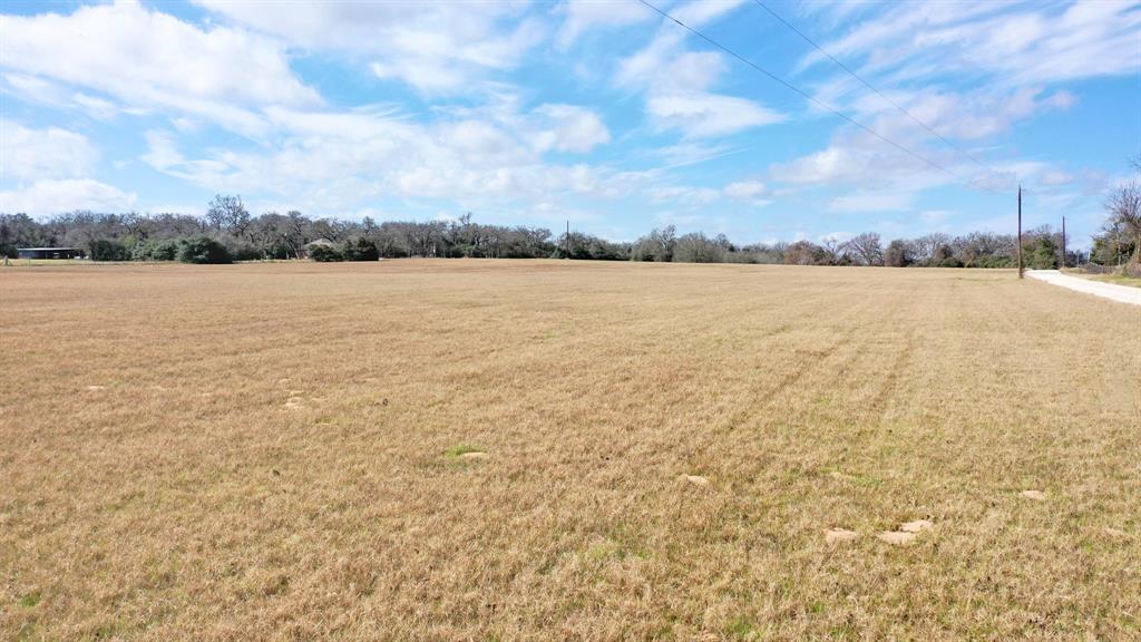 Welcome to Leon County where this beautiful acreage offers a blank canvas presenting a unique blend of developmental opportunities and agricultural potential.  Boasting 12.00+/- expansive acres, this property is completely cleared and open with several choice building sites showcasing the rugged beauty of Brazos Valley.  There is long road frontage and low taxes due to the current Agriculture exemption for hay production in place. The buyer will need to add utilities to this property, there is no HOA or restrictions.  Accessed by a well-maintained county road, this tract is right off of FM 3 in Normangee; approximately 45 minutes from Bryan/College Station and centrally located between Houston and Dallas.