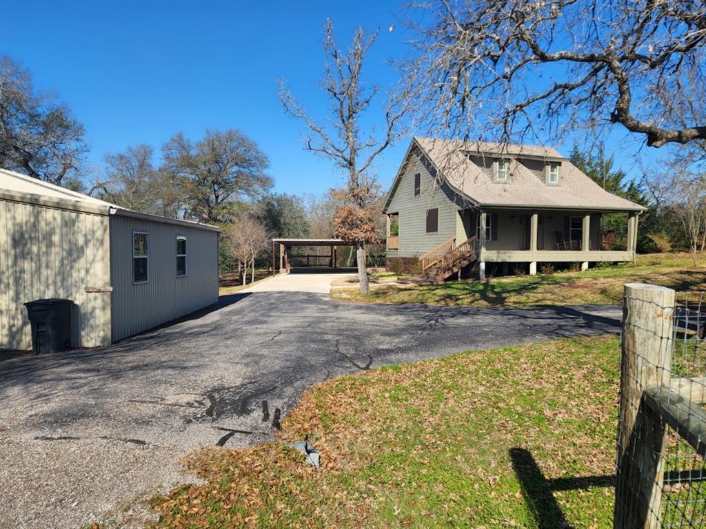 Your picturesque home in the country 10 minutes east of Bryan is calling you. Details abound such as SIP (Structurally Insulated Panel) Walls, Floor and Ceiling construction. Vinyl frame- insulated windows, Demand Gas Water Heater, Mini Split Heat Pump units for heating and cooling, gorgeous wood flooring in the living area. Envision entertaining on the spacious covered deck with wind screen or watching nature's creatures as they pass through the land. In unfavorable weather, gatherings move to the large media room with prep kitchen. There is room for horses or project animals in the fully fenced pastures and the hens will be content in the raised chicken house. Don't worry about drought damage to your garden anymore because of the water storage that can provide life giving water for weeks. Many items such as the refrigerators, chest freezer, power generator, Man Cave TV with Sound System will be conveyed with the home. Don't wait to view this well maintained countryside retreat.