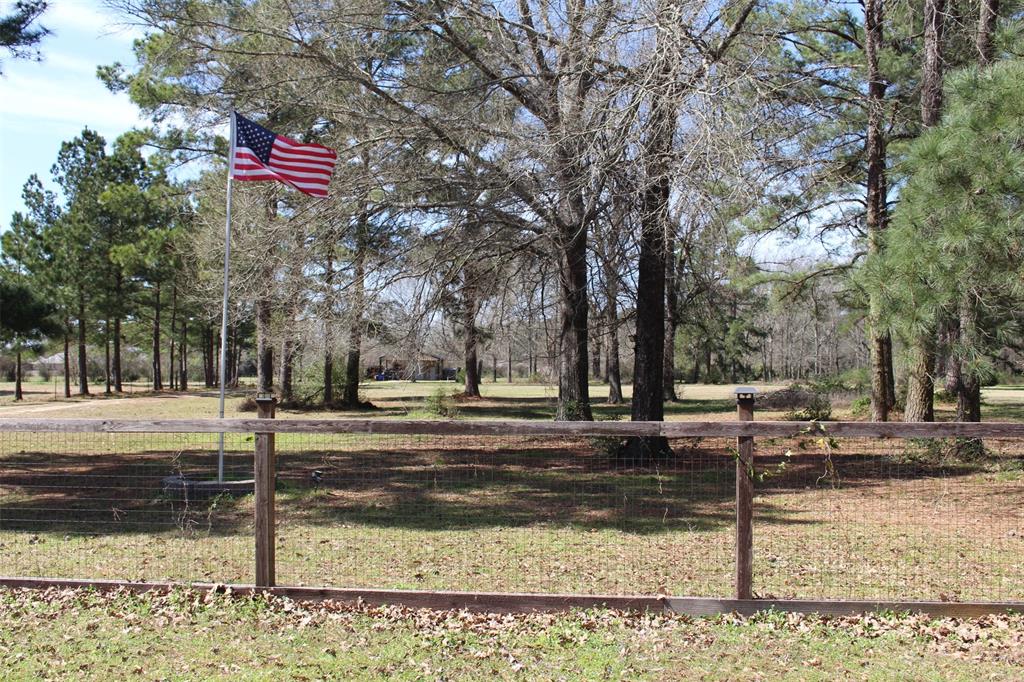 Here lies your private country escape.Mindfully situated on 7.58 acres in the heart of Meadowood Subdivision, minutes from Crockett. This 60X30 Muller Barndominum offers an open concept, with a split floor plan.Complete with 2 bedrooms, a full bath, cozy country kitchen and larger family/dining room area, this custom Barndominium, offers tons of upgrades.The entire building has energy saving spray foam insulation, interior walls are insulated with sound barrier insulation, tankless water-heater provides instant hot water,& laminate flooring throughout provides easy clean up. The kitchen has an electric range with convection oven,space-saving built-in microwave,& side X side refrigerator for inside meal prep.Your outdoor kitchen offers a grill,flatop,& pizza oven,to satisify all of your outdoor cooking desires.Enjoy the game,by the outdoor firplace,in your custom built,wall mounted,TV box,with the TV and soundbar included. it's all right here at  542 Briargrove.