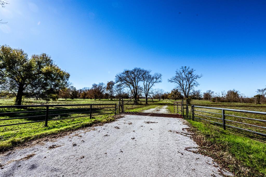 250+/- acres of hunter and cattle ranchers' paradise, just 1.5 hours from Houston! This property is perfectly positioned to become the ranch of your dreams, with 4,500 feet of frontage along FM 2548. With sandy soils, improved pastures, and the potential for hay production, it's a cattleman’s delight and also offers great potential for hunting or recreational use. Additionally, the property is equipped with two water wells, a small pond, and driving trails throughout for easy access to all areas of the land. Schedule your showing today!