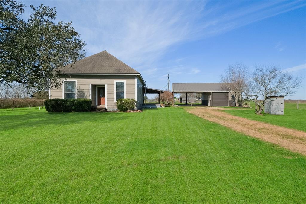 This charming vintage home is nested on a 3-acre corner lot in the highly sought-after East Bernard School District. Featuring original hardwood floors, stunning decorative columns in the dining room, high ceilings, and a beautifully updated kitchen, this home blends classic character with modern comfort. The spacious primary bedroom is a must-see! Outside, the fenced and cross-fenced pasture is ready for your animals, while the huge covered back porch offers the perfect spot to unwind after a long day. Plus, the shop is ideal for all your projects. Don't miss out on this incredible country retreat!