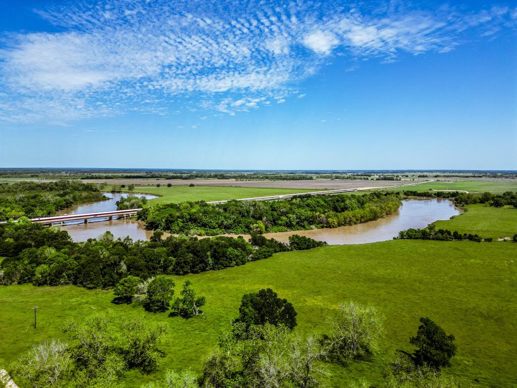 588-acre ranch with 6,000 feet of Trinity River frontage and 4,500 feet along FM 2548. This property is a current for cattle ranch, hunting, and pecan farm, offering both agricultural and recreational value. Well-fenced grazing areas, reliable water sources, and productive hay pastures make livestock operations smooth and efficient. The income-producing pecan orchards provide a steady yearly harvest, adding investment potential. With a diverse landscape of open fields, wooded areas, and fertile farmland, this ranch is ideal for ranching, outdoor activities, or simply enjoying nature. It features four water wells to support livestock and farming needs. Abundant wildlife, stunning river views, and easy water access make it a prime location for hunting, fishing, and relaxation. Whether you're expanding your ranch, seeking a private retreat, or investing in premium land, this property offers incredible potential. Seller financing terms available. Schedule your private showing today