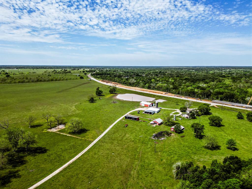 This 435-acre ranch offers a great opportunity for cattle ranching, pecan farming, fishing, and outdoor recreation. It features 6,000 feet of Trinity River frontage, 4,500 feet along FM 2548, and 2,500 feet of Highway 21 frontage, providing excellent access and visibility. The property includes 150 acres of productive pecan orchards for steady income. It has well-fenced grazing pastures, three water wells, and a network of well-planned roads for easy travel across the land. With abundant wildlife, fishing, river views, and great hunting, this ranch is perfect for ranching, recreation, or investment.