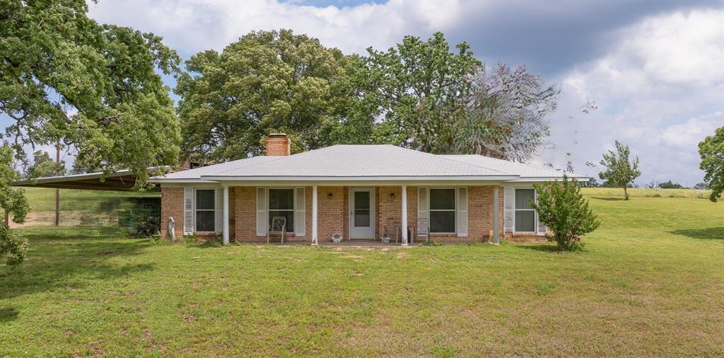 This 10.57-acre ranch in Tennessee Colony, TX, offers country charm and functional space. The 3-bedroom, 2-bathroom, 2,063 sq. ft. Craftsman-style home, built in 1969, features a wood-burning fireplace insert and has been partially updated while preserving its character.

The multi-use property is fenced and cross-fenced, formerly a cattle ranch, and includes a 1,600 sq. ft. industrial workshop with an attached 480 sq. ft. shed and office, ideal for business, storage, or hobbies. Additional outbuildings provide space for livestock and equipment. With an enclosed water well and community water access, water supply is secure. 867 feet of road frontage on US-287 N offers excellent accessibility.

Perfect for ranching, hobby farming, a home-based business, or a private retreat, this estate is full of potential. Schedule your private tour today!