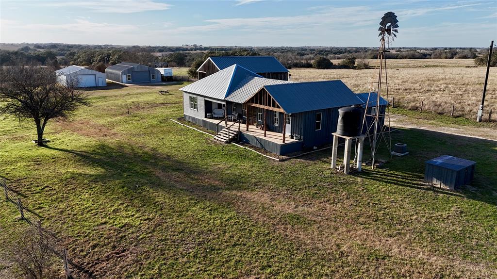 Welcome to the farm! If you are looking for a farm house on acreage, this is it! The 3 bed, 2 bath home sits on 15 acres & was remodeled and updated in the fall of 2022. It features an updated kitchen, bathroom vanities, & underground electrical. Sit on your elevated front porch and watch the sunrise and the sunset and gaze at your beautiful rolling, long views near Praha. The interior has a farm house sink, antique clawfoot tub, new wood stove, & a new island. The home has 2 separate AC units, one unit is just a year old. The property has a 40x30 barn with roll up doors & a 2nd 40x30 barn with a wide roll up door. The property features a set of cattle pens, a shed & garden area, and a pen for livestock. Completely fenced and cross fenced. The acreage is offered with a “No Drill Clause” protecting the land and your investment from any future oil and gas drilling activity.  Located 1.5 hours from Houston, Austin, & San Antonio, this property is in a very desirable area of Lavaca County.