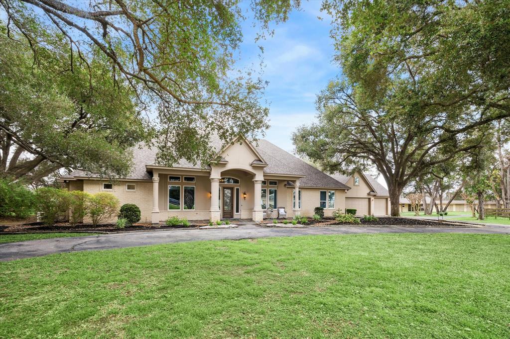 This exquisite one-story home on ~ 14 gated, unrestricted acres offers a luxurious country lifestyle with city convenience. The property includes a main house (~3,984 sq/ft) with pool and spa, a three-bedroom guest house (~1,900 sq/ft), cross-fenced pastures, a three-stall horse barn with tack room, a storage barn, chicken coop and show pen. Inside, custom features abound with coffered and tray ceilings, hardwood floors, and a chef’s kitchen boasts double ovens, a gas range, and glazed cabinetry, complemented by elegant twin pendant lighting. Spacious primary retreat offers an en suite bath with French doors leading to the backyard. Fixed glass windows in the main living area showcase the expansive views. A circular driveway with an electronic gate ensures privacy. With no restrictions, enjoy raising cattle, chickens, or FFA projects. Located minutes from the Grand Parkway, private schools, and shopping, dining, and entertainment areas. This is what freedom looks like!