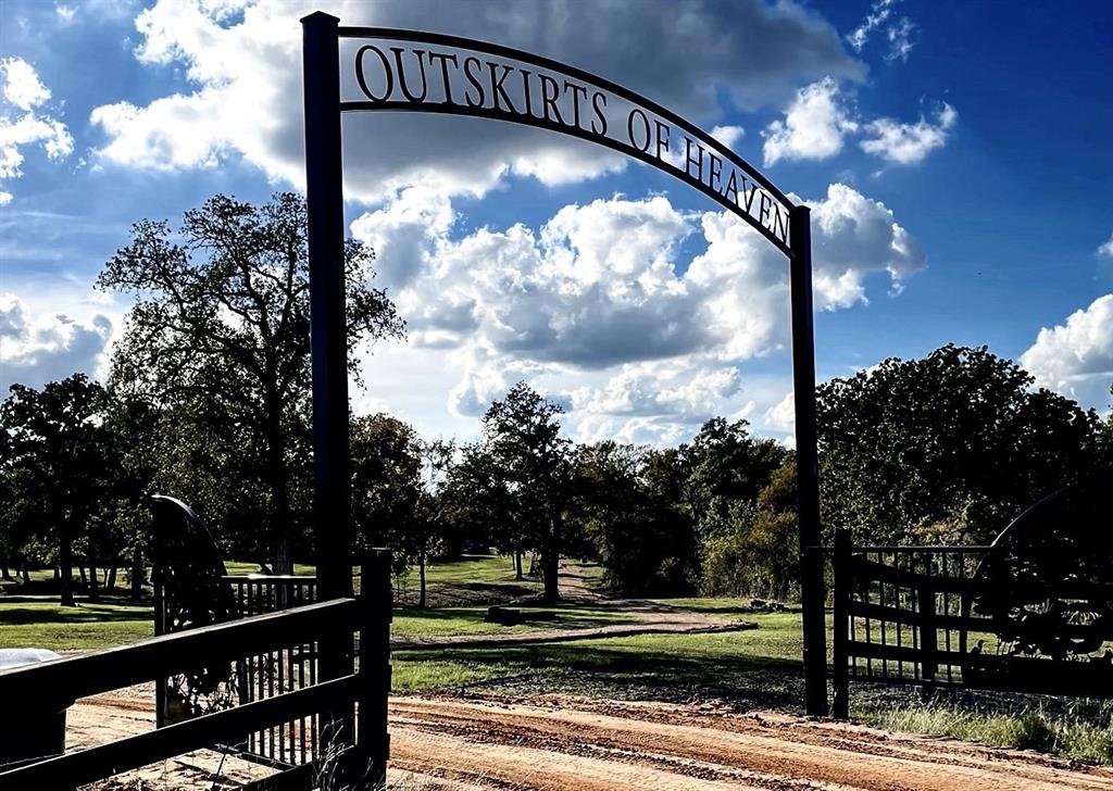 OUTSKIRTS OF HEAVEN is perfectly located between Brenham and Navasota. This property was spared no expense while preparing for a new home. A cell phone/touch pad activated custom gate with camera is 1,000' of improved road, across the creek and up to a designated home site. Completely fenced in, this 15 acres is equipped with 400amp power supply, a Pressure Distribution Septic System to accommodate a large house, dual motor coach pads with 50amp, water and sewer, good for guest or while building, and a small storage shed with electricity. The front 5 acres, "The Park" with a water and power manifold that's supplied by a 2" underground water line from the future home site's high-capacity water well that helps with irrigating the park. Over 60 manicured oaks, improved rye grass park and the rear 10 acres are native habitat with fence perimeters cleared. Jordan Creek Equestrian Estates consists of 8 multi-acre properties with access to a horse stable within the development. A MUST SEE!