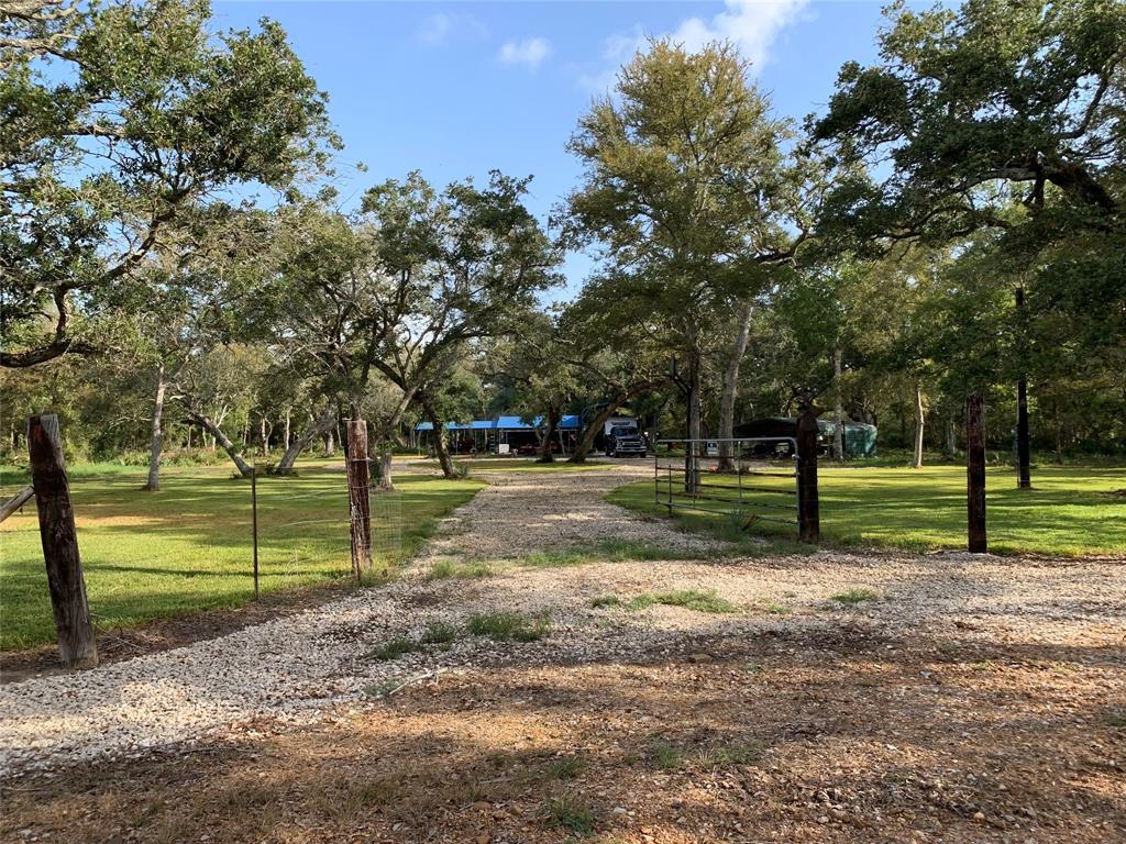 This 25-acre wooded property, bordered by two large ranches, offers excellent bow hunting for trophy deer in a  private gated community. Included with your HOA membership is access to Cedar Lake Creek with a community boat ramp and pier, ideal for fishing (trout, redfish, catfish, and large gar) and crabbing in season. Property includes a multitude of accessories (camper, tractor, feeders, etc.).  Property is 8 miles from Sargent which allows for bay fishing. Lake Jackson (22 mi.) and Bay City (15 mi.) are easily accessible for restaurants, shopping and non-water recreational activities.

This property is a blank canvas. Whether you envision it as a weekend getaway, a seasonal retreat, or a year-round residence, the possibilities are endless. You might build a cozy cabin, create trails for hiking and riding, or develop areas for family gatherings. Your dreams and creativity can transform this property into a bespoke sanctuary that reflects your passions and lifestyle.