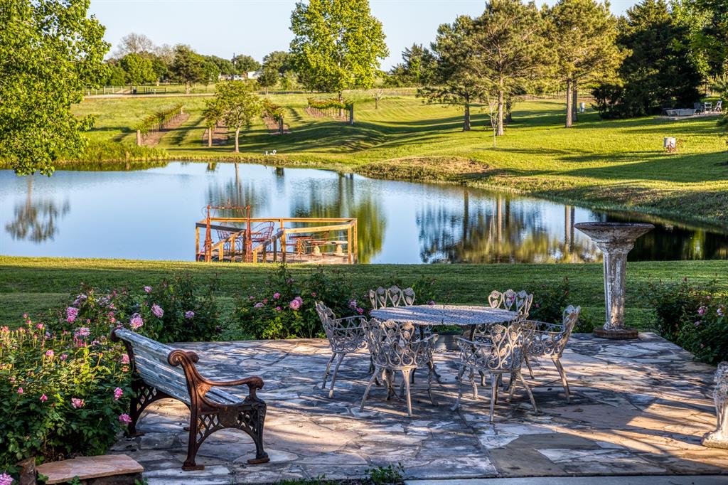 Exquisite country setting showcasing a 4/2 French Country Barn, a designer finished 2/2 home that is an artistic vision from the hand-hewn beams and vintage wide-plank wooden flooring to the vintage antique doors. A charming 1/1 “chapel guesthouse” reminiscent of a church from the 1800’s which provides a romantic stay and a memorable backdrop for any bride.  In addition there is a 3000 sq ft barn with central air/heat with 2 story glass roll up doors overlooking a pond and rolling hill country side, with the option for using it as an event center. All of the structures are situated atop of the highest point in Washington County and overlooking a stocked pond, rolling hill country side and a 400 grape vineyard which has already produced a tasty Blanc du Bois wine. Property is ideal for a stunning family compound or a proven income producing property for the past 10 years. ROUND TOP, known for the famous twice-yearly antique show is a short 5 minute drive to the first venue.