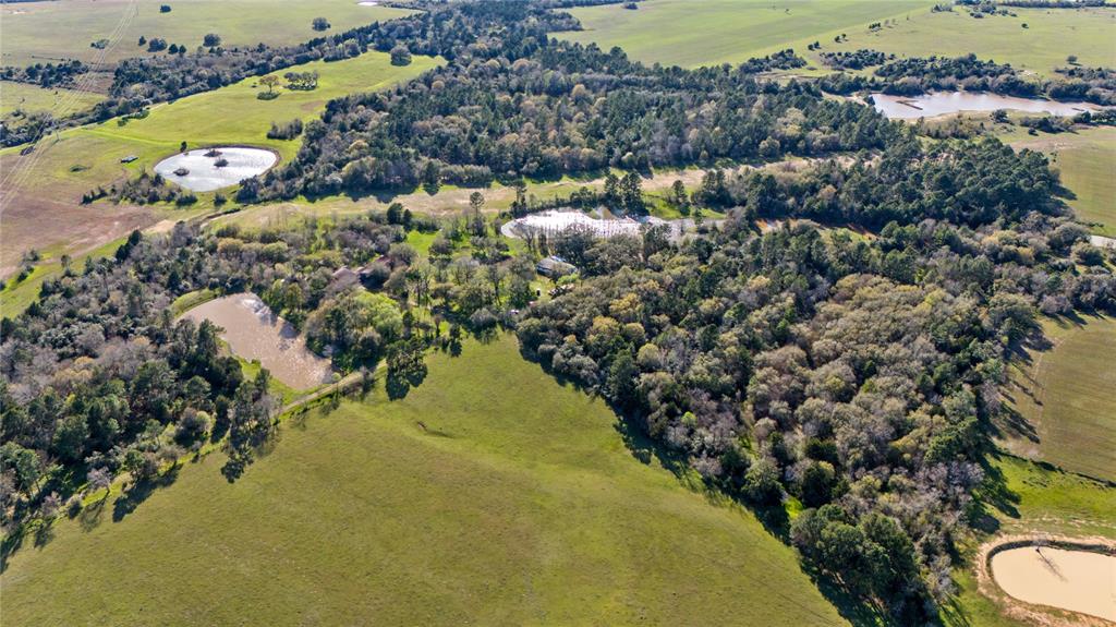 Beautiful Sealy property. Look at this peaceful and picturesque property! The combination of 106 +/- acres, three ponds, and mature trees offers a wonderful, serene atmosphere. The addition of a manufactured home in 2022 means it's relatively new, which could be a great benefit for anyone looking to settle in quickly with modern amenities.

The addition of a barn is perfect for anyone with agricultural or hobby farm interests, and the presence of wildlife makes the property even more special for nature lovers. Whether you’re into farming, horseback riding, or simply enjoying the outdoors, this property offers a wide variety of opportunities for relaxation and recreation.