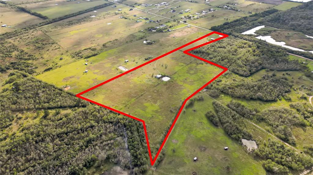 Almost 32 acres of paradise.  Make this your weekend getaway or your new homestead.  Unleash the potential that this property has to offer.  Well, septic tank and Electricity on site and available.  Close proximity to the new hwy 99 to head over to Baytown or New Caney in minutes.  10 minutes away from Atascocita.  Come check this one out now!  Land Survey Available and AG Exempt in place!