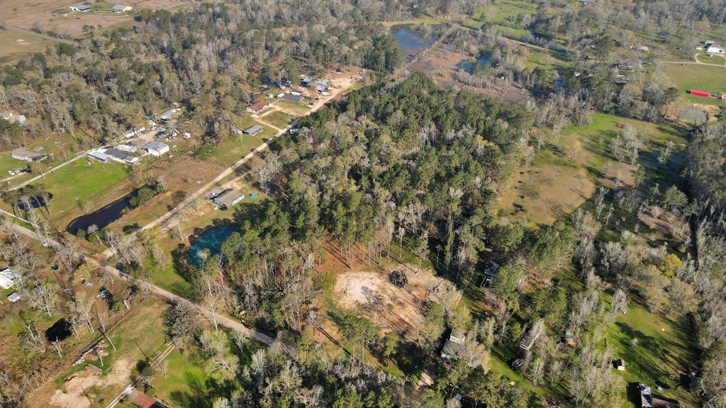 8.34 acres in Conroe, TX ready for new owners! Entrance by current driveway has been cleared and elevated, buyer to verify that it is where it needs to be for house pad use. Gorgeous trees throughout for you to pick and choose which ones stay and go. This can be your country living with a 10 min drive to HEB - Harpers Trace and 15-20 mins to Methodist, St.Lukes, TX Children's, and Memorial Herman Hospitals. Lots of commercial growth and residential development in the immediate area. No deed restrictions! Horses allowed. 1.589% TAX RATE!!! Located 10-20 minutes from The Woodlands, New Caney, Porter & Splendora and all of the shopping and restaurants. Dimensions: 403'X903'. Existing survey available. Easy access to major highways - FM1314, GP99, 242, 45N and 59N.