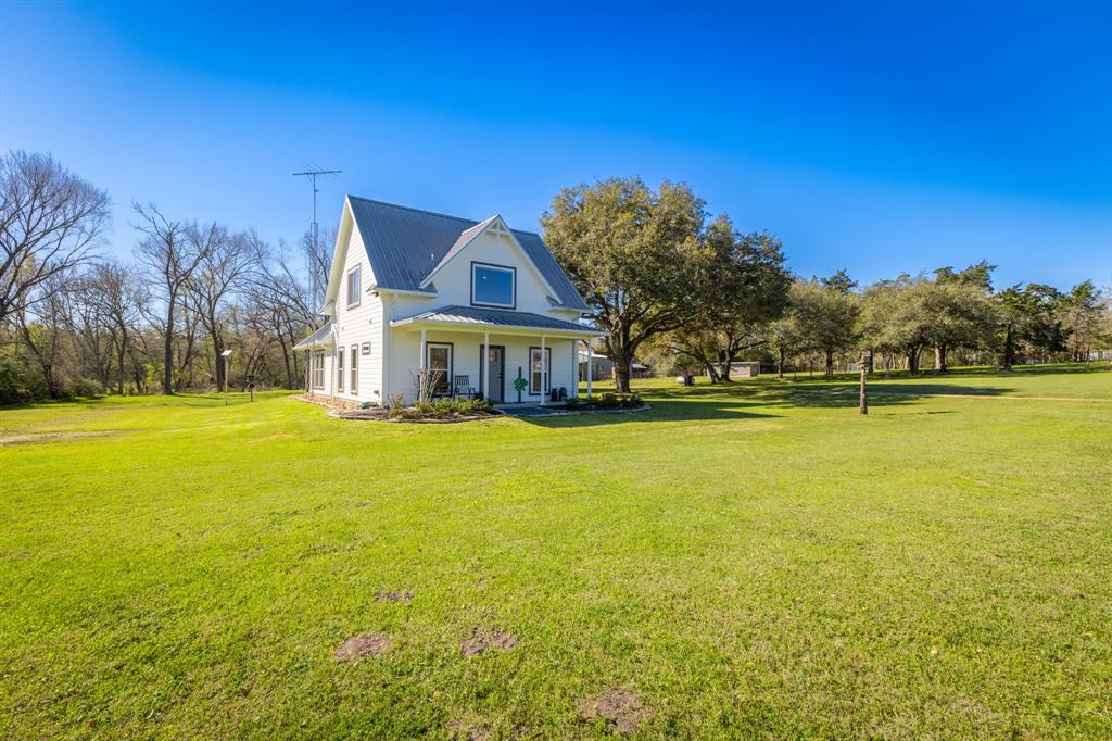 Stunning gem on the outskirts of Brenham and a short drive to Round Top, this beauty is a must-see with it's two private bedroom retreats each with ensuite bath.  The open floorplan and inviting colorscheme exudes a warm and inviting atmosphere.  Abundant windows allow for 360 views of the beautiful 3+ acres which includes a view to the creek where you will be delighted by birds and other wildlife.  Amazing 40x30 auxilliary building with 30x13 air conditioned area provides an escape for movie night, game night, entertaining friends and family or just chillin.  This property would make the oh-soo perfect retreat, second home or cozy spot for most any occasion or quiet lifestyle. 
Call today to schedule your private tour, you won't be disappointed!