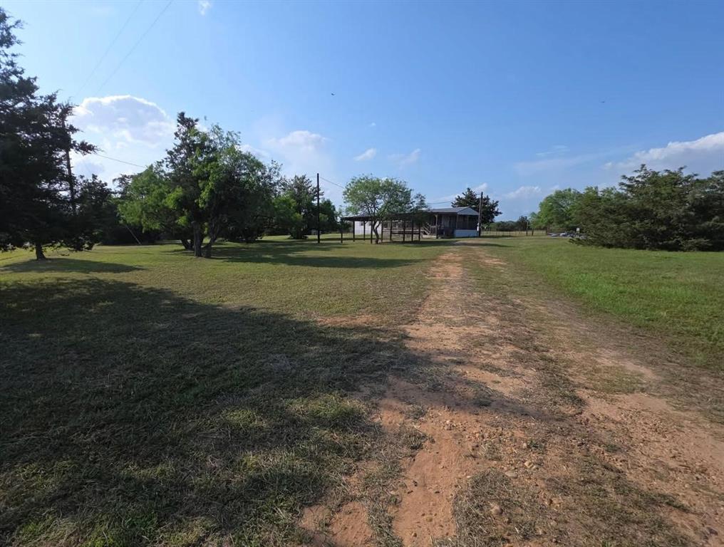 1245 Cr 211 Weimar, Texas Tucked away in the heart of Central Texas only about an hour away from Houston. AG EXEMPT beautiful 6-acre lot with scattered trees with 3 sides fenced. Walk into this spacious 1200 sq ft 2-bedroom 2bath home located
just 5 minuets from Columbus Tx. Freshly painted, new flooring installed throughout the home ready for move in. Step outside onto the charming, oversized porch to enjoy the tranquil outdoors while sipping on your favorite beverage and enjoy the serenity of country living. Property includes 50-amp RV hookup with separate meter with water, septic line. Property fenced on 3 sides, horse pen for your horses etc. Great weekend retreat, or piece of heaven to call home. Your paradise awaits!